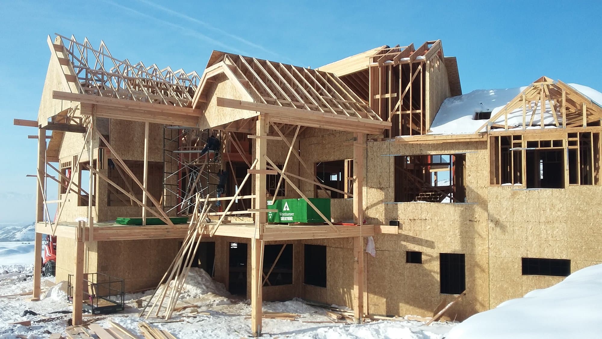 Custom home framing project during a Utah winter build by Elevation 100